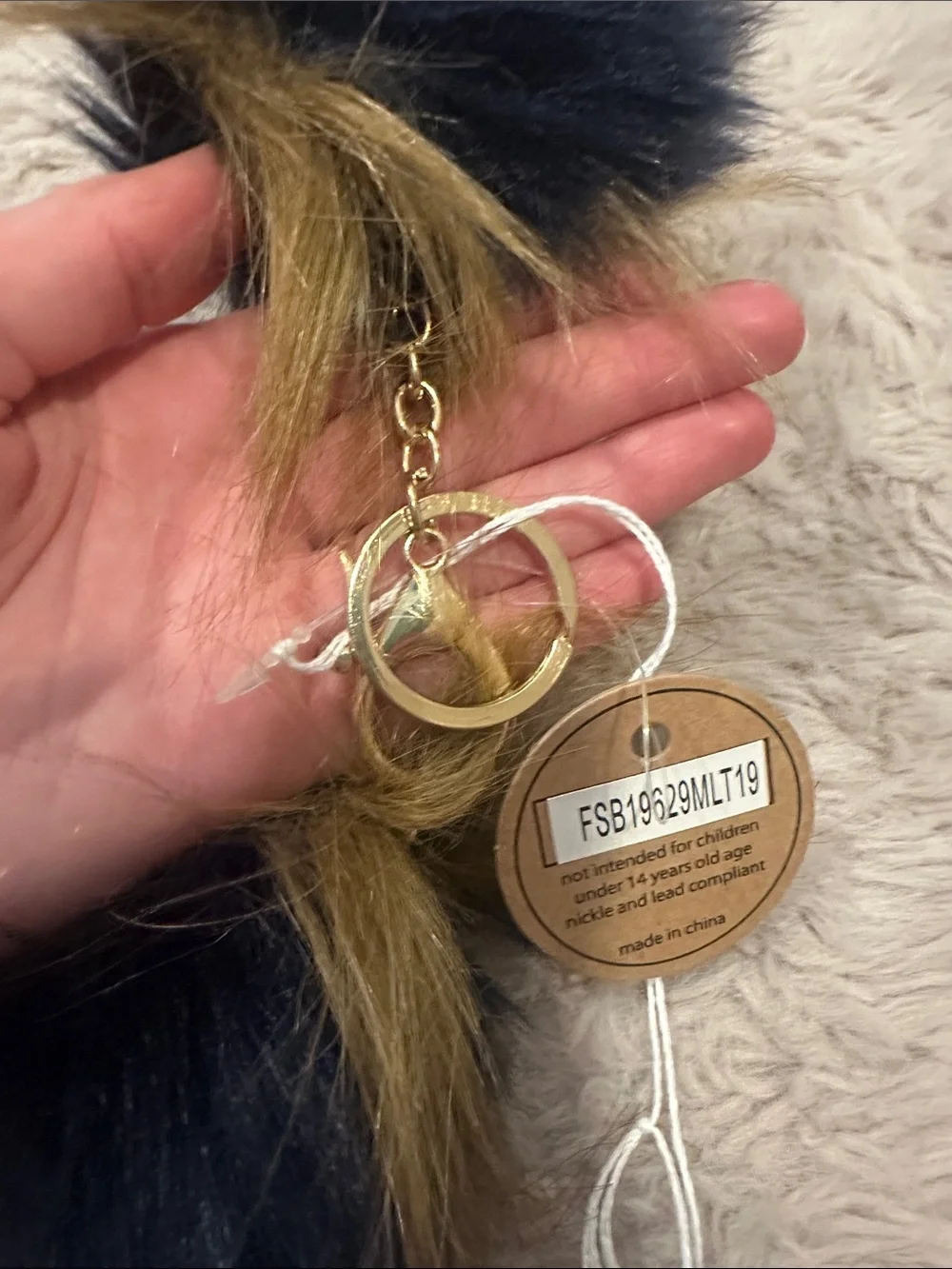 HEIMISH USA Black and Gold Faux Fur Clutch with Pom Keychain